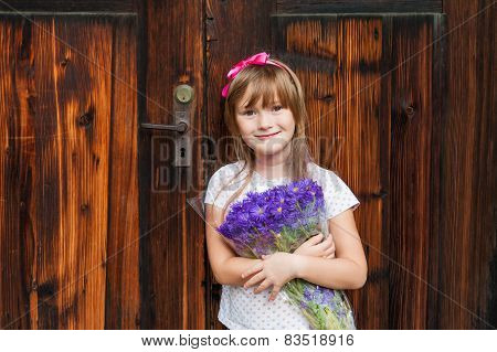 Outdoor portrait of a cute little girl