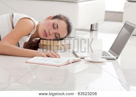Female Student Sleeping On The textbooks