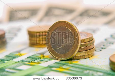 a tower of Euro coins, banknote, European currency