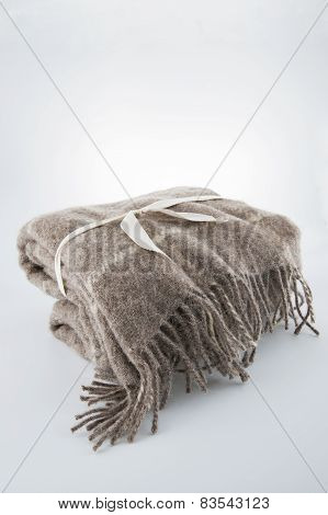 Wool Blanket Tied With A Ribbon..