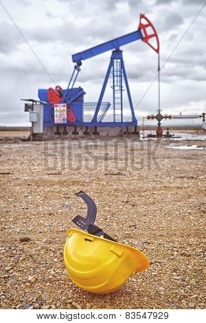 Pumpjack Oil Pump And Industrial Helmet