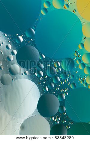 Oil and water abstract in silver, black, blue and gold