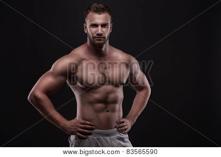 muscular man isolated on black background