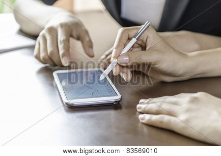 women using tablet with stylus pen