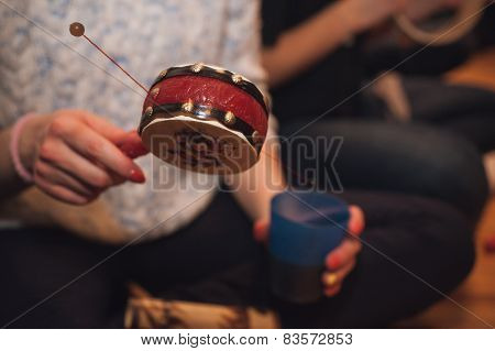 Women Playing Spin Drum No Face