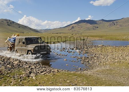 Mongolian people relocate nomadic tent by car in Kharkhorin, Mongolia.
