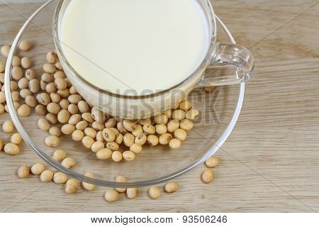 Soybeans and Soy milk on wooden background, healthy food.