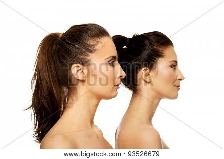 Two attractive sisters with make up.