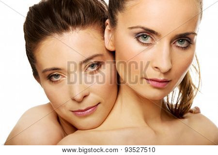 Two attractive sisters with make up.
