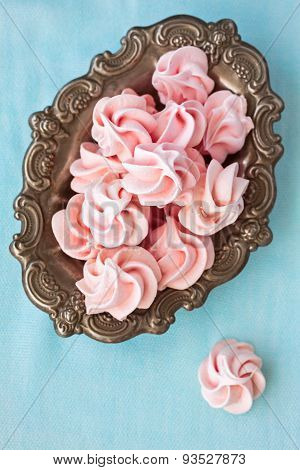 Pink Meringue In Antique Old Plate, On Blue Background,  Top View