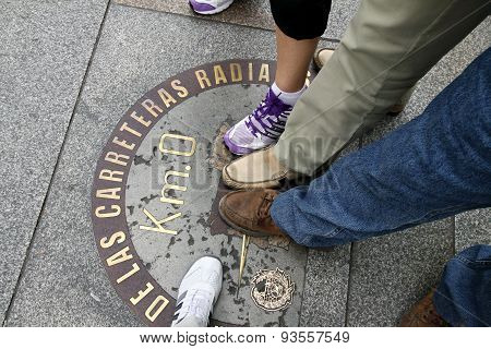 Legs Of Tourists On The Mark 