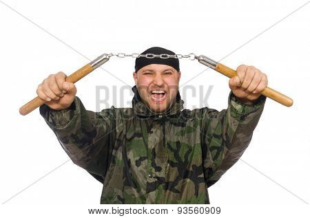 Young man in soldier uniform holding nunchaks isolated on white