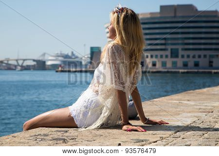 Young Woman Enjoys The Sun In Barcelona.