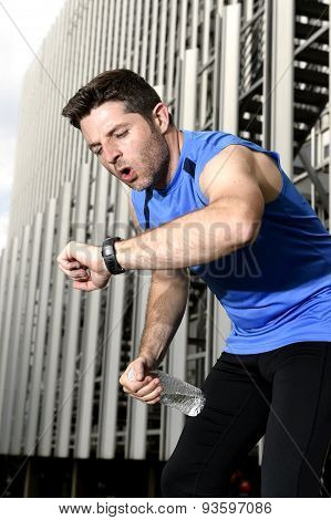 Sport Man Breathing Exhausted After Running Leaning Tired And Checking Timer Watch
