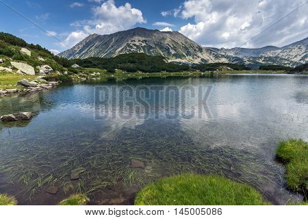 Amazing panorama of todorka peak and Reflection in Muratovo lake, Pirin Mountain, Bulgaria