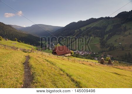 Summer landscape above the village in Moeciu de Sus - Bran, Romania