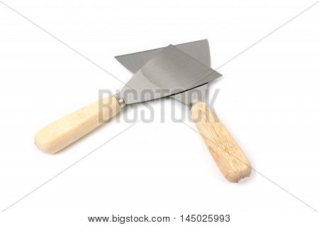 Two steel putty spattles on white background.