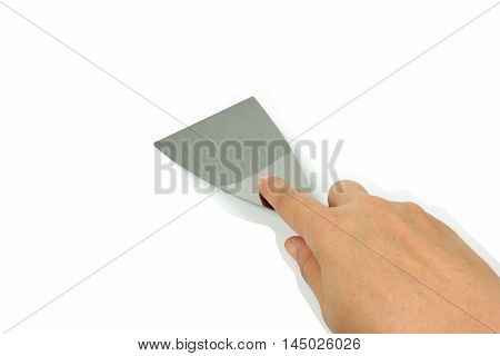 steel putty spattles in hand on white background.