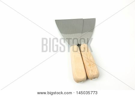 steel putty spattles on white background .