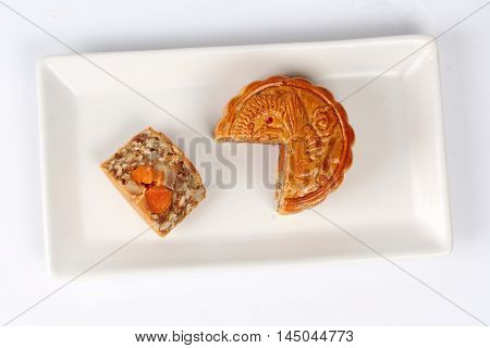A dish of Mooncake filling five seed and salt eggs on white background.