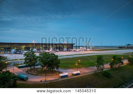 Kuala Lumpur, Malaysia - circa August 2016: View of KLIA, Kuala Lumpur International Airport, Malaysia, at dawn. KLIA is the biggest airport in Malaysia and is a major airport in Asia. The photo shows the exterior, runaway, airplanes towed in front of the