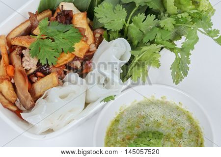 Roll noddle served with fried tofu and mixed vegetables.