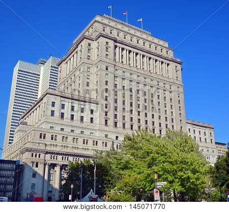 MONTREAL QUEBEC CANADA AUGUST 30 2016: The Sun Life Building is an historic office building at 1155 Metcalfe Street. Place ville Marie in background.