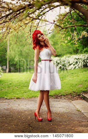 The girl with red hair on a green background