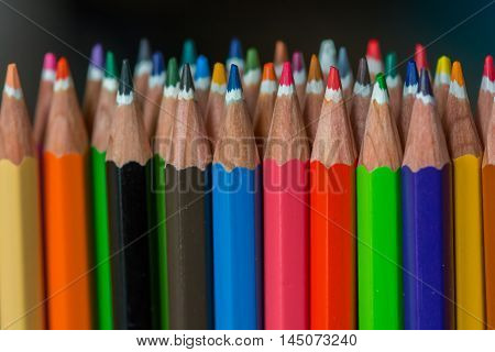 Sharp colorful crayons grouped as a bunch