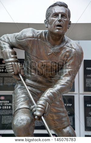 MONTREAL QUEBEC CANADA AUGUST 17 2016: Statue of Jean Beliveau former hockey player in front the Bell Center. He was inducted into the Hockey Hall of Fame in 1972.