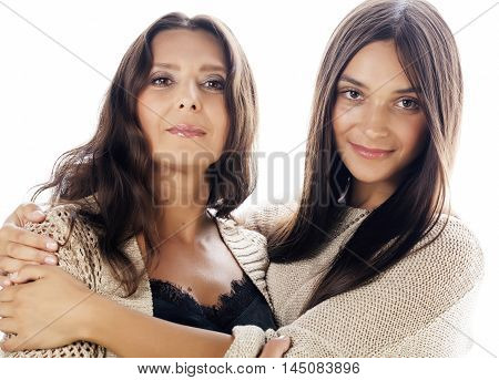 cute pretty teen daughter with real mature mother hugging, fashion style brunette makeup close up tann s, warm colors isolated on white background