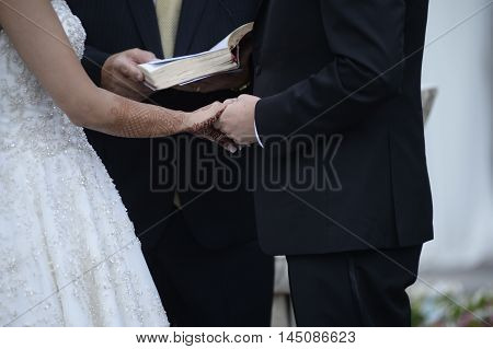 Happy Stylish Newlyweds In The Ortodox Church At Wedding