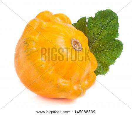 one yellow pattypan squash with leaf isolated on white background.
