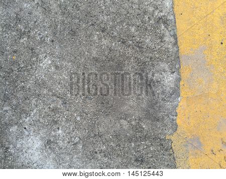 Concrete road with yellow stripe texture .