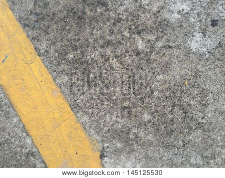 Concrete road with yellow stripe texture .
