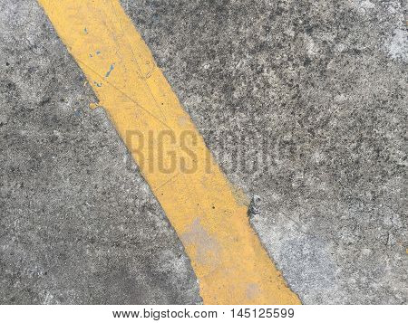 Concrete road with yellow stripe texture .