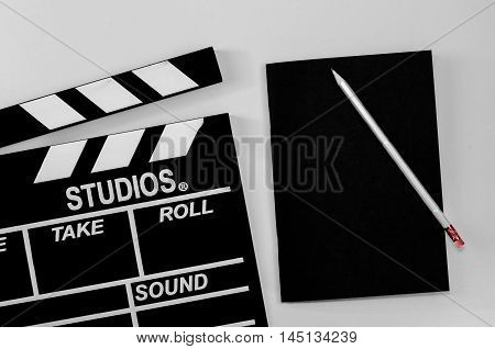 Slate film and black notebook white background