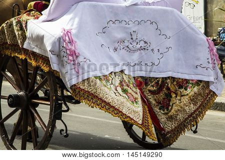 SELARGIUS, ITALY - September 8, 2013: Former marriage Selargino - Sardinia - detail of a decorated cart