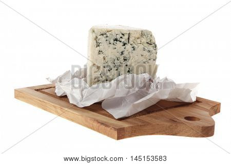 aged italian deli fresh blue stilton cheese served on wooden cutting plate isolated over white background