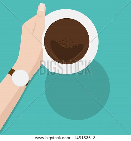 Coffee cup in female hand on green background