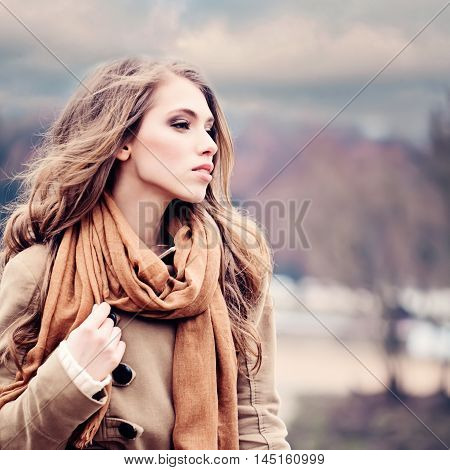 Fashion Model Woman with orange hair Outdoors