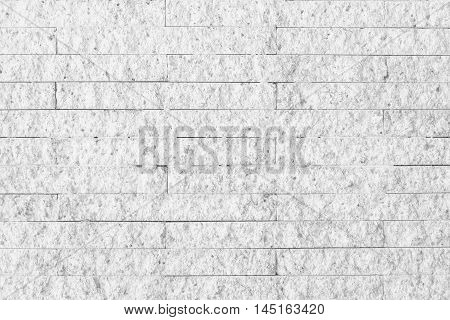 Surface white wall of stone wall gray tones for use as background.