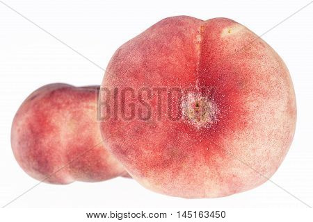 Fruits of Saturn Peach ( Paraguayos ) isolated on white background .