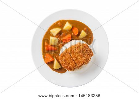 Top view of Japanese cuisine rice with deep fried pork and curry sauce with potatoes and carrots in ceramic dish isolated on white background