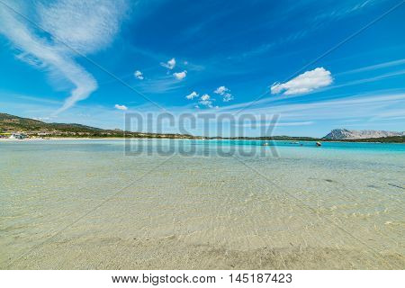 white clouds over Lu Impostu beach Sardinia