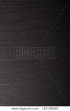 Black slate background. Deep black stone texture.