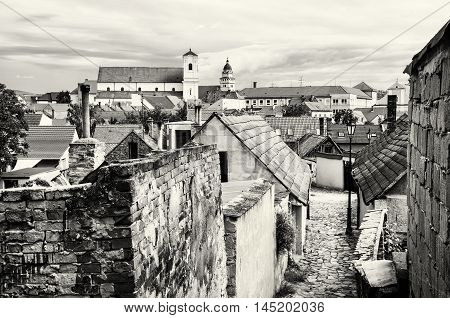 Old houses streets and churches in Skalica town Slovak republic. Travel destination. Black and white photo. Architectural theme.