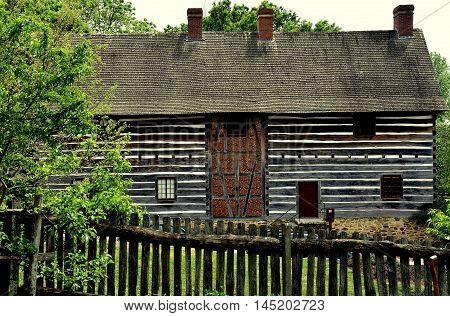 Old Salem North Carolina - April 21 2016: Fachwerk log and stucco barn at the 1769 Single Brothers' House