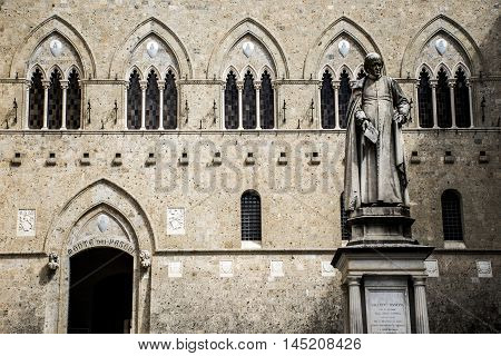 Sculpture in front of the bank Monte dei Paschi in Siena in the tuscany