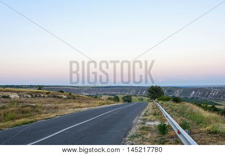 The road to Orheiul vechi memorial complex at sunset in Moldova